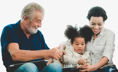 Older man with woman and young child playing chess